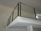 Escalier a limon central acier + rambardes inox et verre